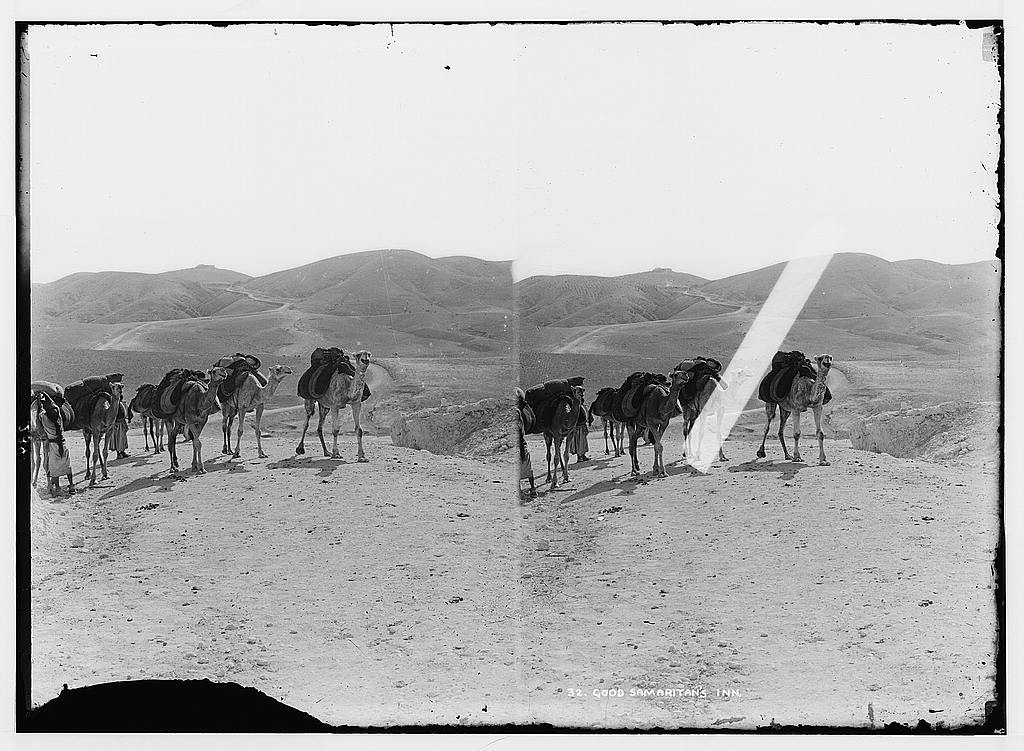 A dirt road winding through bare, rocky hills between Jerusalem and Jericho, photographed in the early twentieth century.